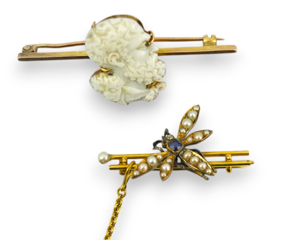 An Edwardian 15ct mounted cameo shell bar brooch, 49mm, together with a yellow metal, sapphire and split pearl cluster set dragonfly bar brooch, 11 grams. Condition - fair